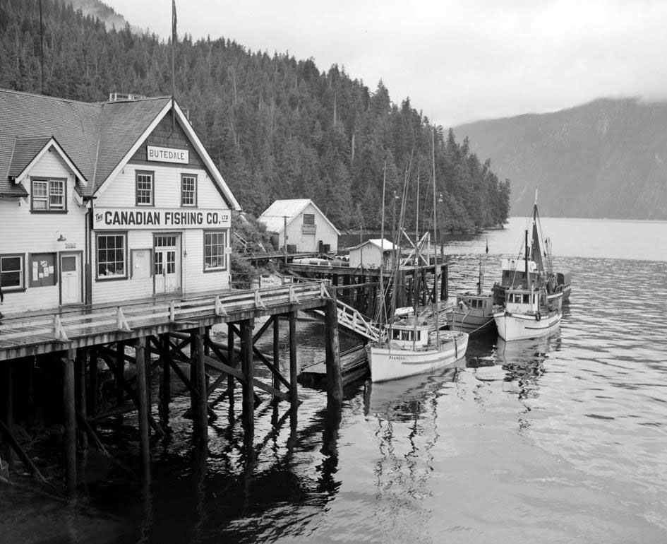 Wharf at the Butedale cannery village. Signs on the main building read "Butedale" and " The Canadian Fishing Co. Ltd."